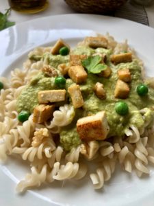 vegan spelt fusilli with tofu and walnut and pea sauce